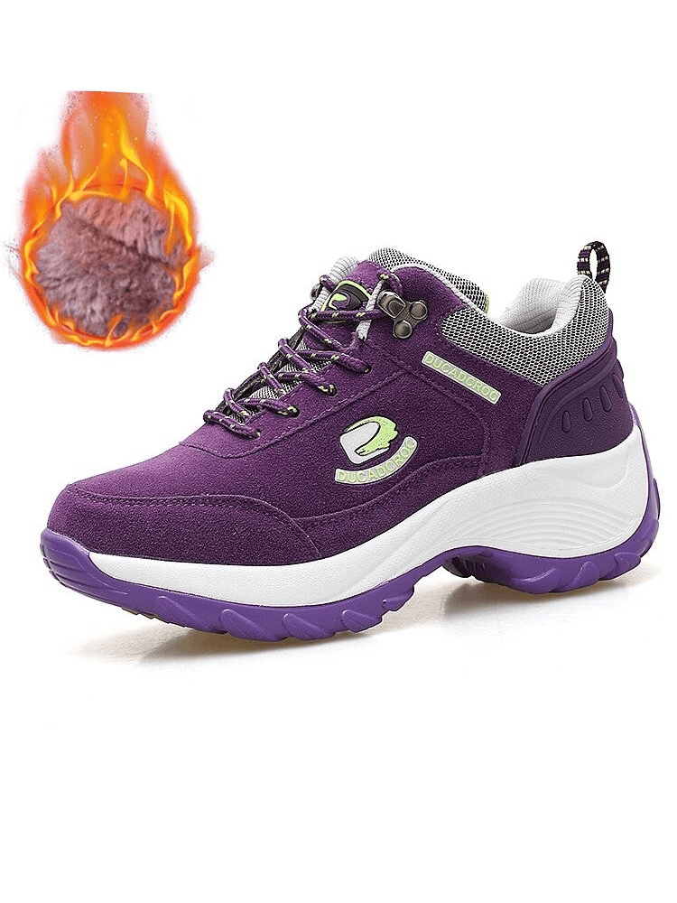 Purple insulated sports sneaker with faux fur, non-slip lace-up, suede finish, and mid-heel; perfect for warmth and style.